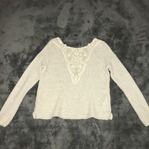 Knit sweater.